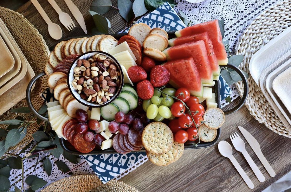 Areca palm leaf charcuterie and grazing board served on Ecodyne palm leaf platter for French wholesale catering distributors