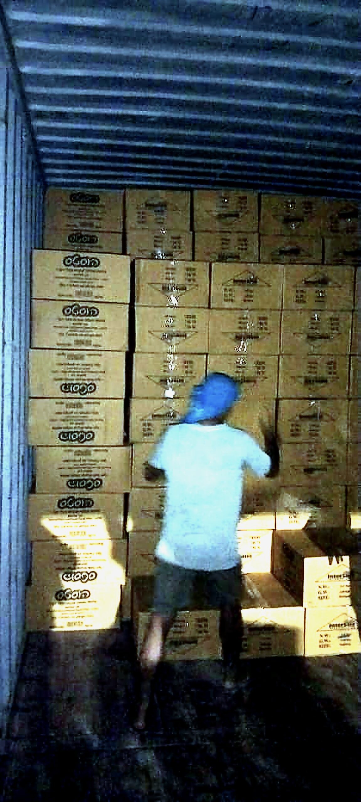 Container loading at the Karnataka manufacturing facility — palm leaf tableware cartons prepared for ocean freight export to the United States via FOB New Mangalore Port